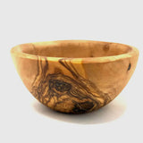 Single olive wood pinch bowl from a low angle, a natural wood condiment dish
