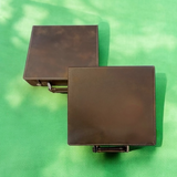 Two plain brown leather 100 chip poker set cases, ready for custom engraving